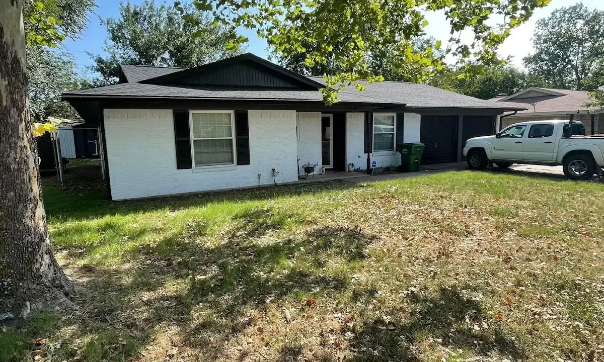 Professional roofing crew working on a residential roof in Wahiawa